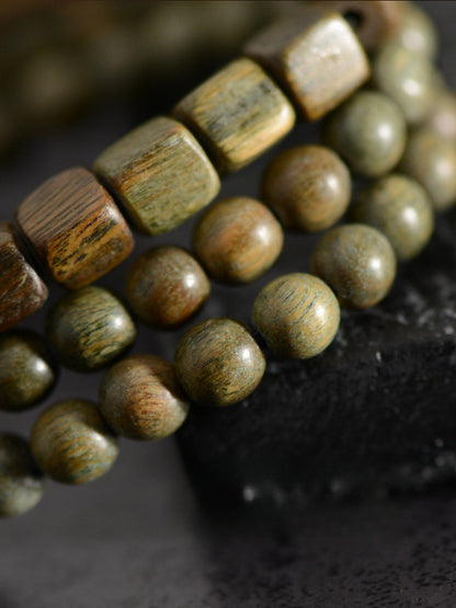 Bracelet de perles Dzi à deux yeux en agate de bois de santal vert