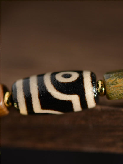 Bracelet de perles Dzi à deux yeux en agate de bois de santal vert