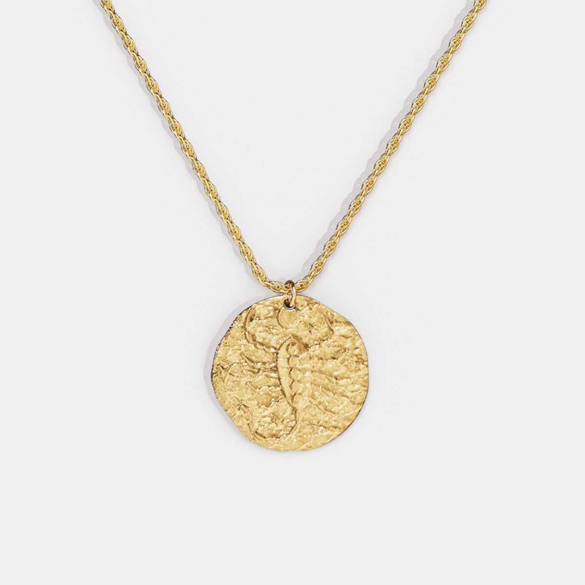 Collier pendentif zodiaque en or martelé