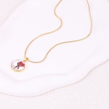 Collier de fleurs de naissance pressées