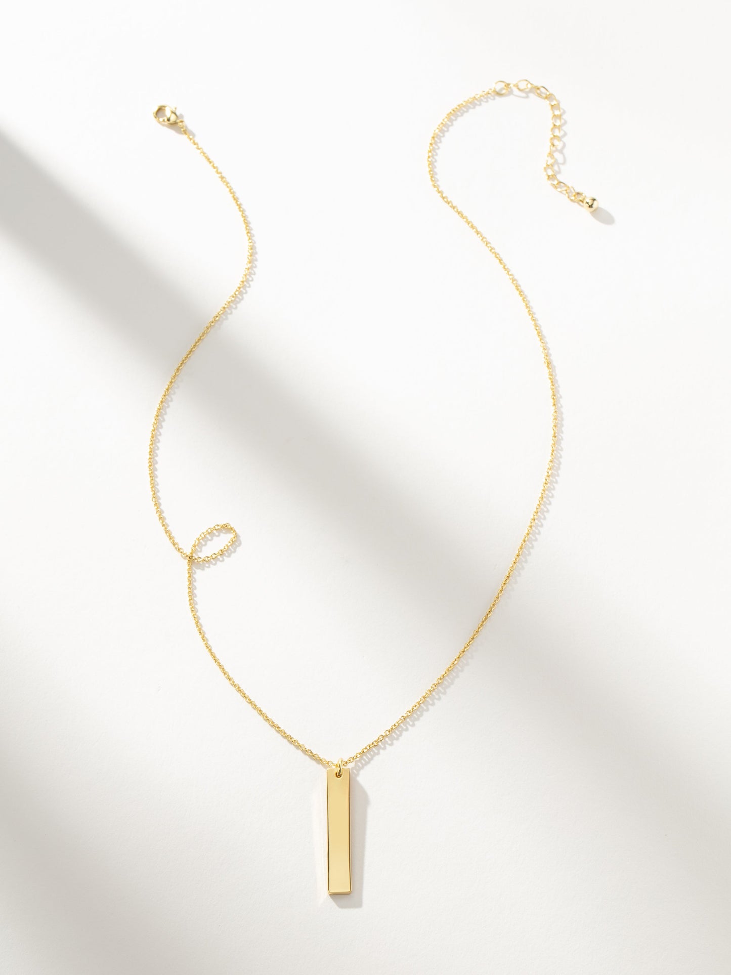 Collier à barre verticale