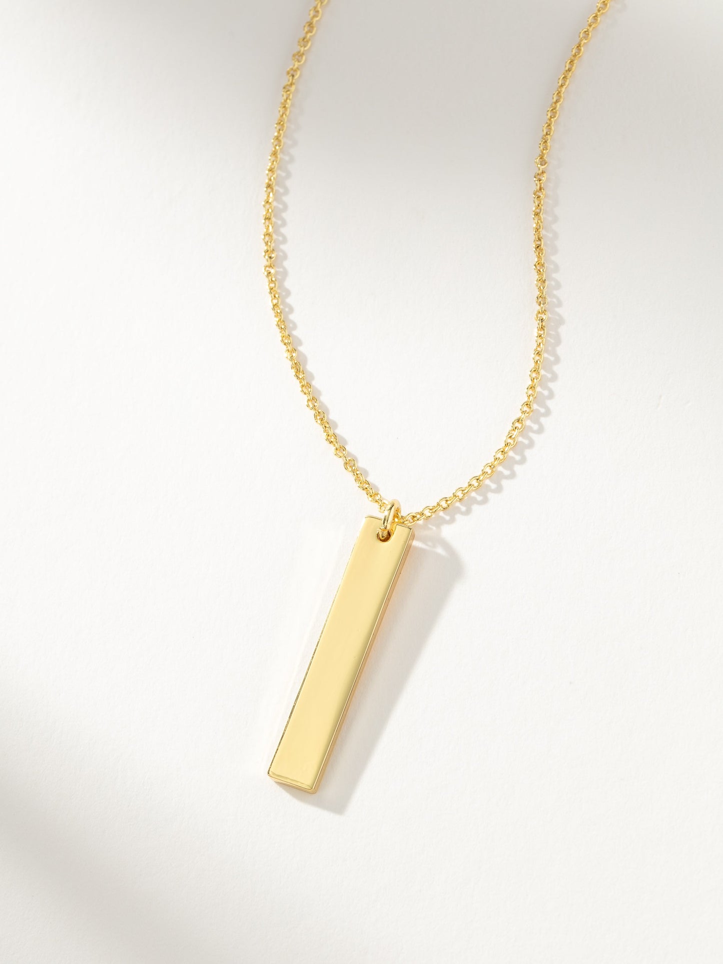 Collier à barre verticale