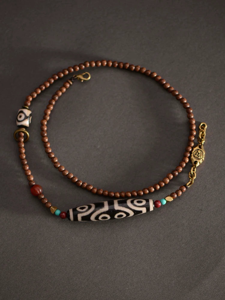 Pendentif perles dzi tibétaines en bois de santal doré 58 mm