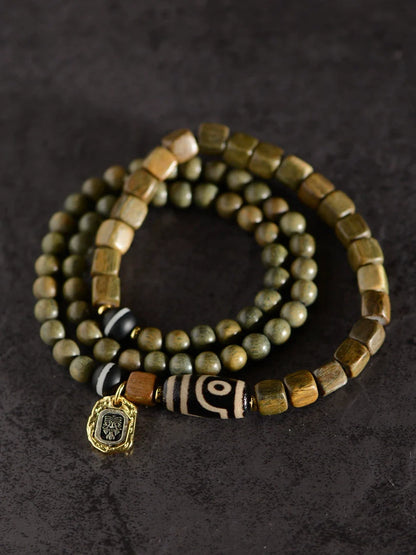 Bracelet de perles Dzi à deux yeux en agate de bois de santal vert