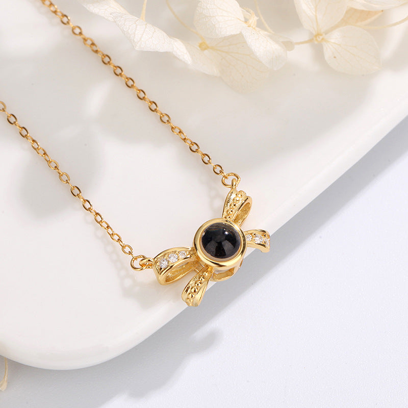 Hübsche Schleifenkette mit verstecktem Foto