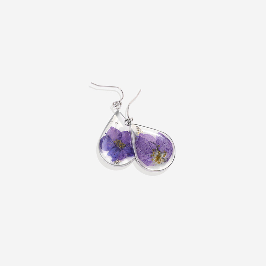 Boucles d'oreilles en fleurs de naissance pressées