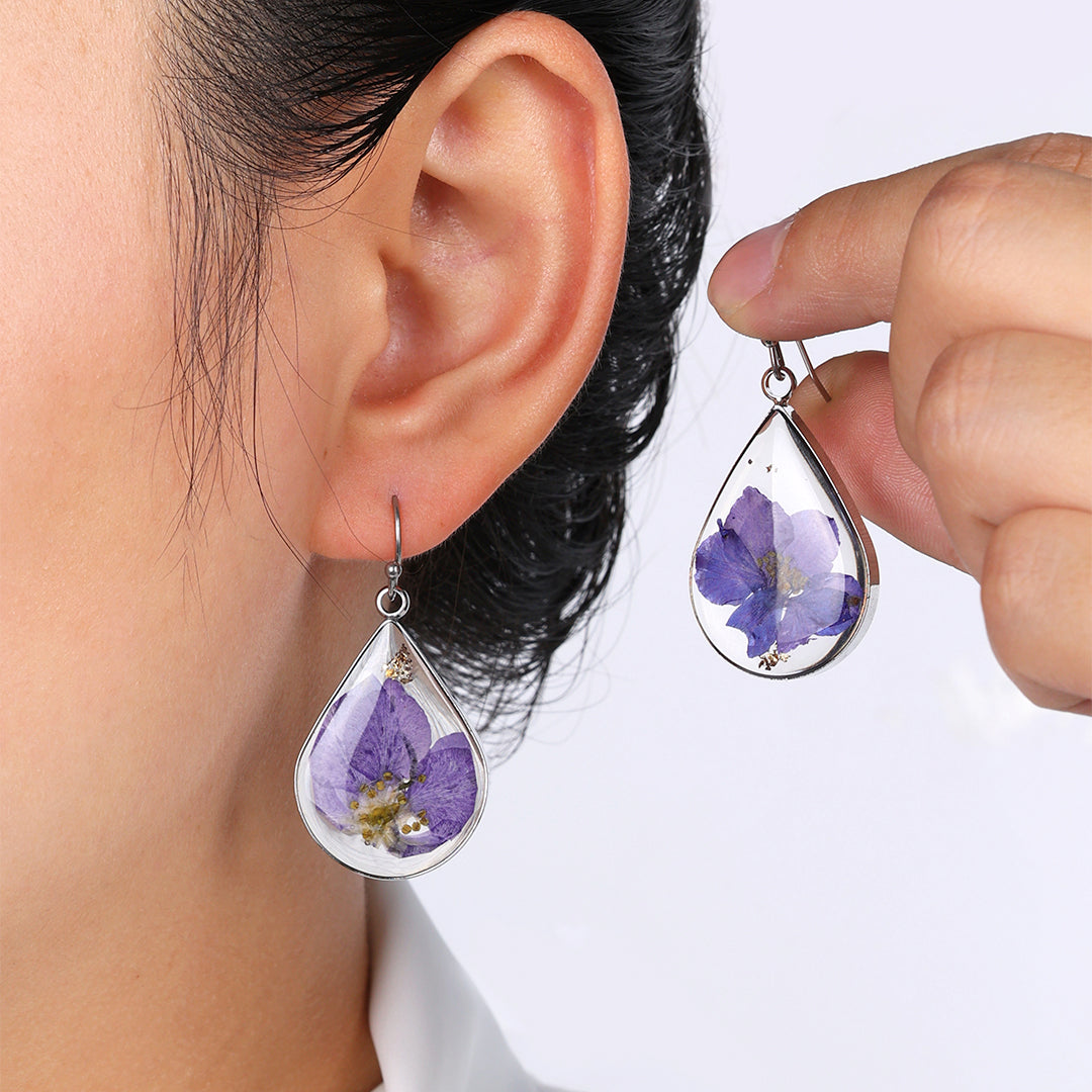 Boucles d'oreilles en fleurs de naissance pressées