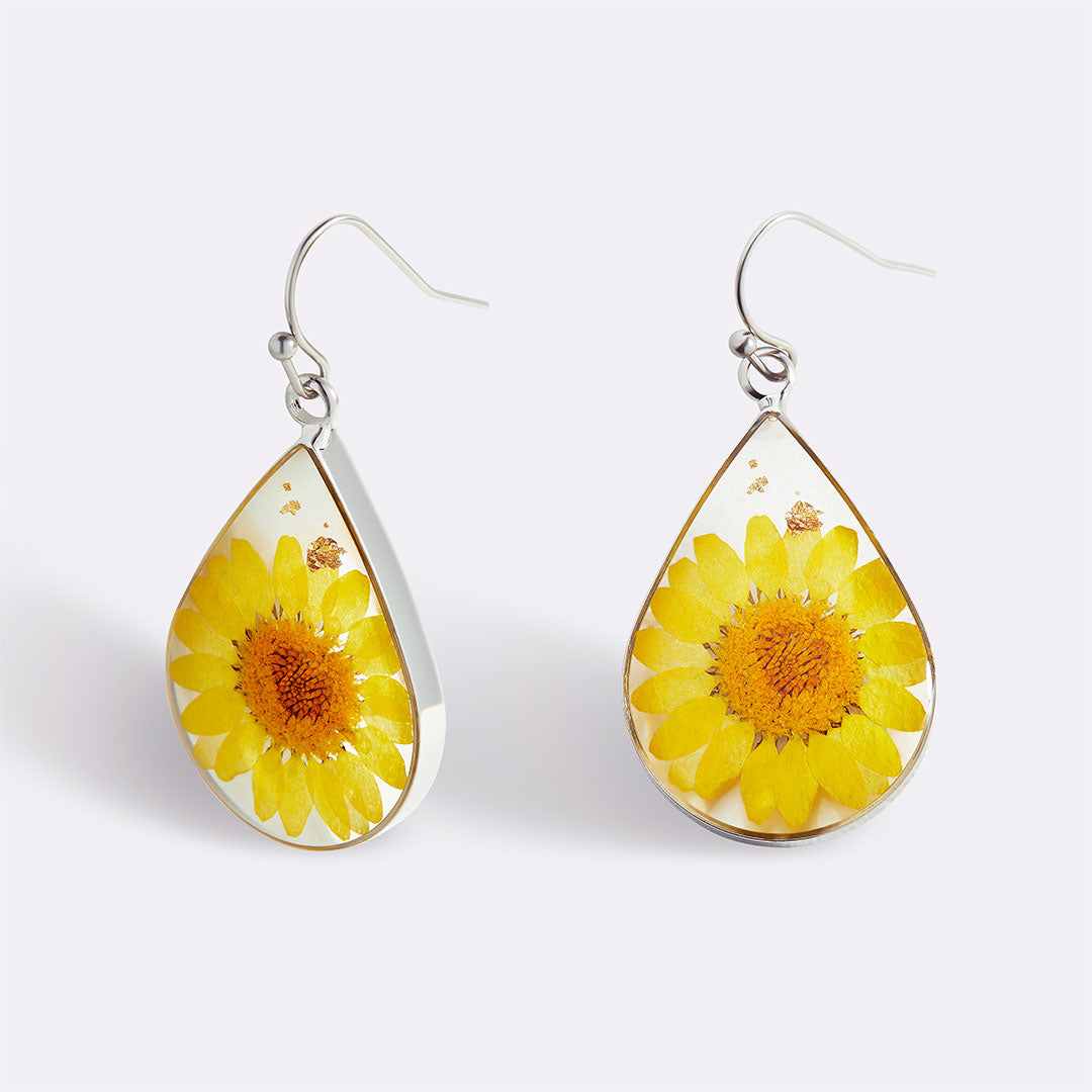 Boucles d'oreilles en fleurs de naissance pressées