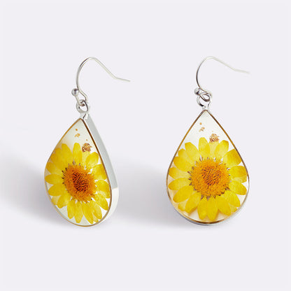 Boucles d'oreilles en fleurs de naissance pressées