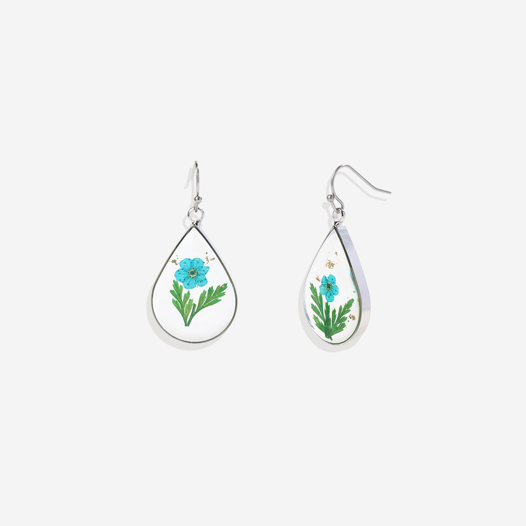 Boucles d'oreilles en fleurs de naissance pressées