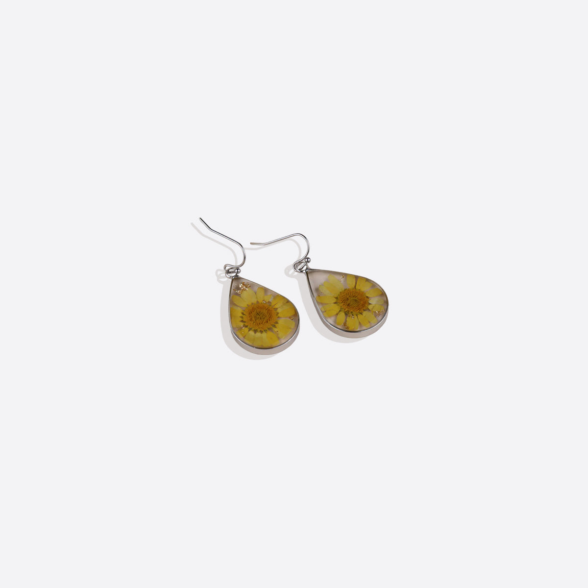 Boucles d'oreilles en fleurs de naissance pressées