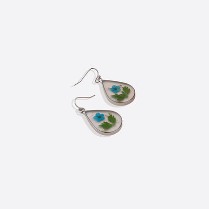 Boucles d'oreilles en fleurs de naissance pressées