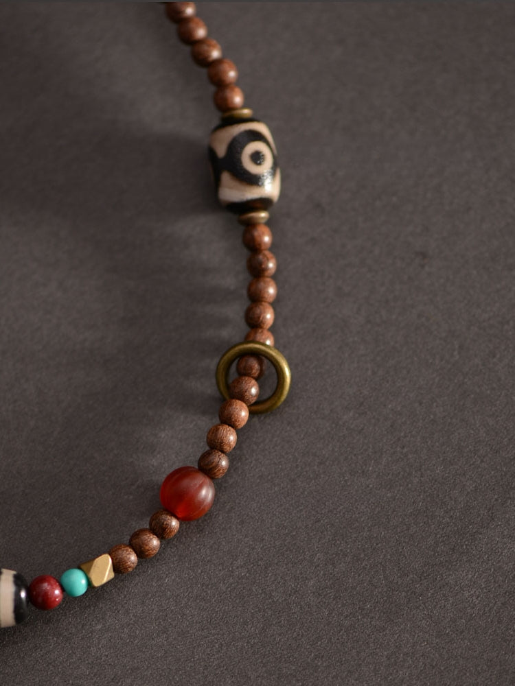Pendentif perles dzi tibétaines en bois de santal doré 58 mm