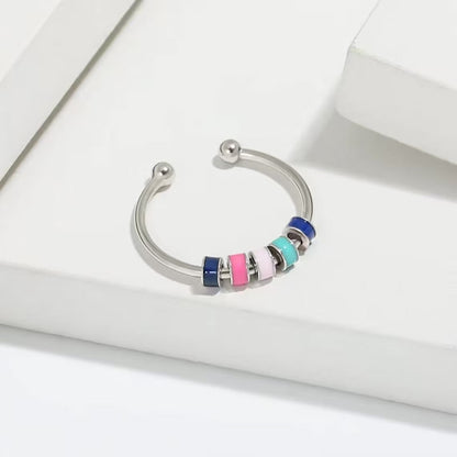 Spinnender Zappelring mit Emaille-Perlen