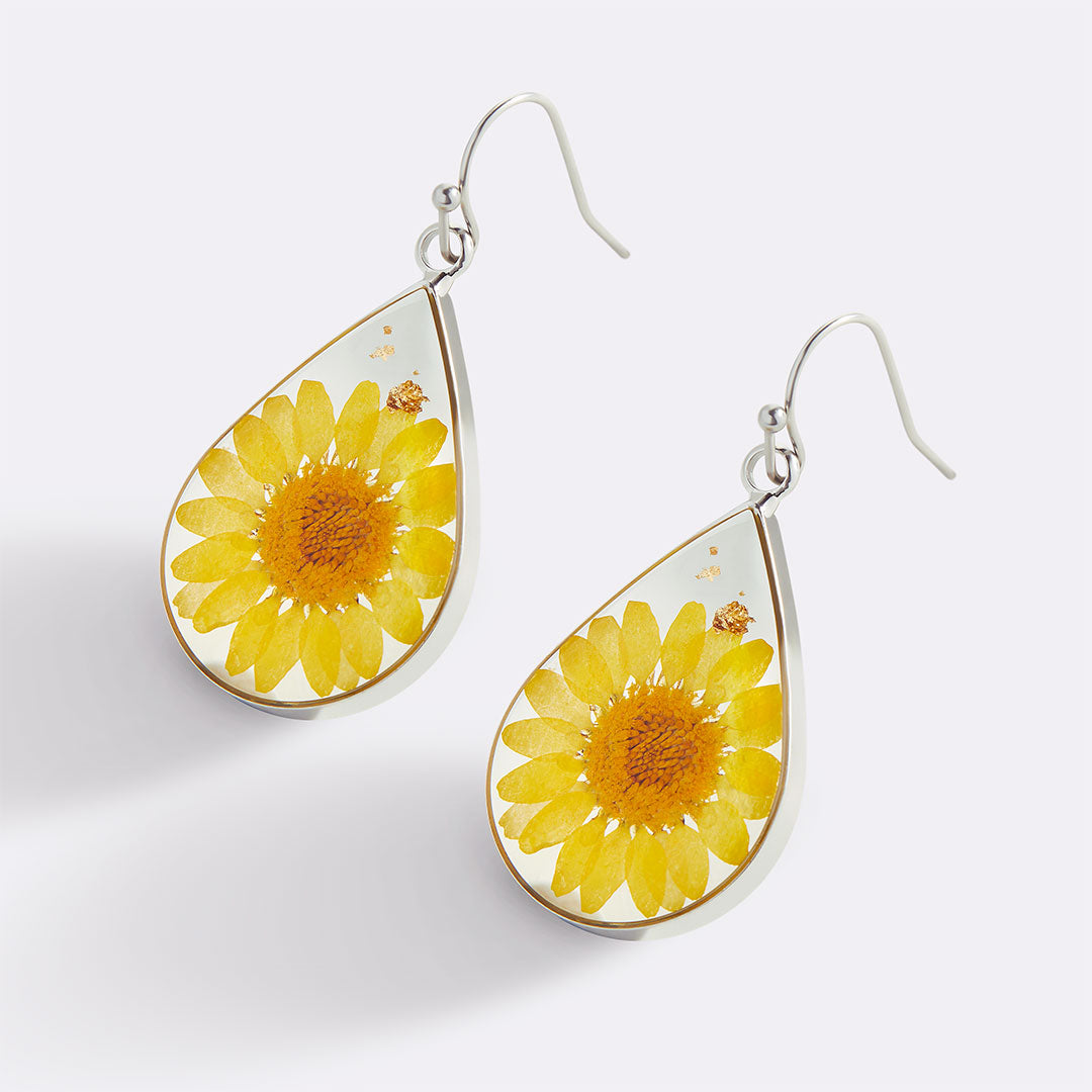 Boucles d'oreilles en fleurs de naissance pressées