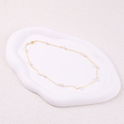 Collier ras du cou à dix perles 